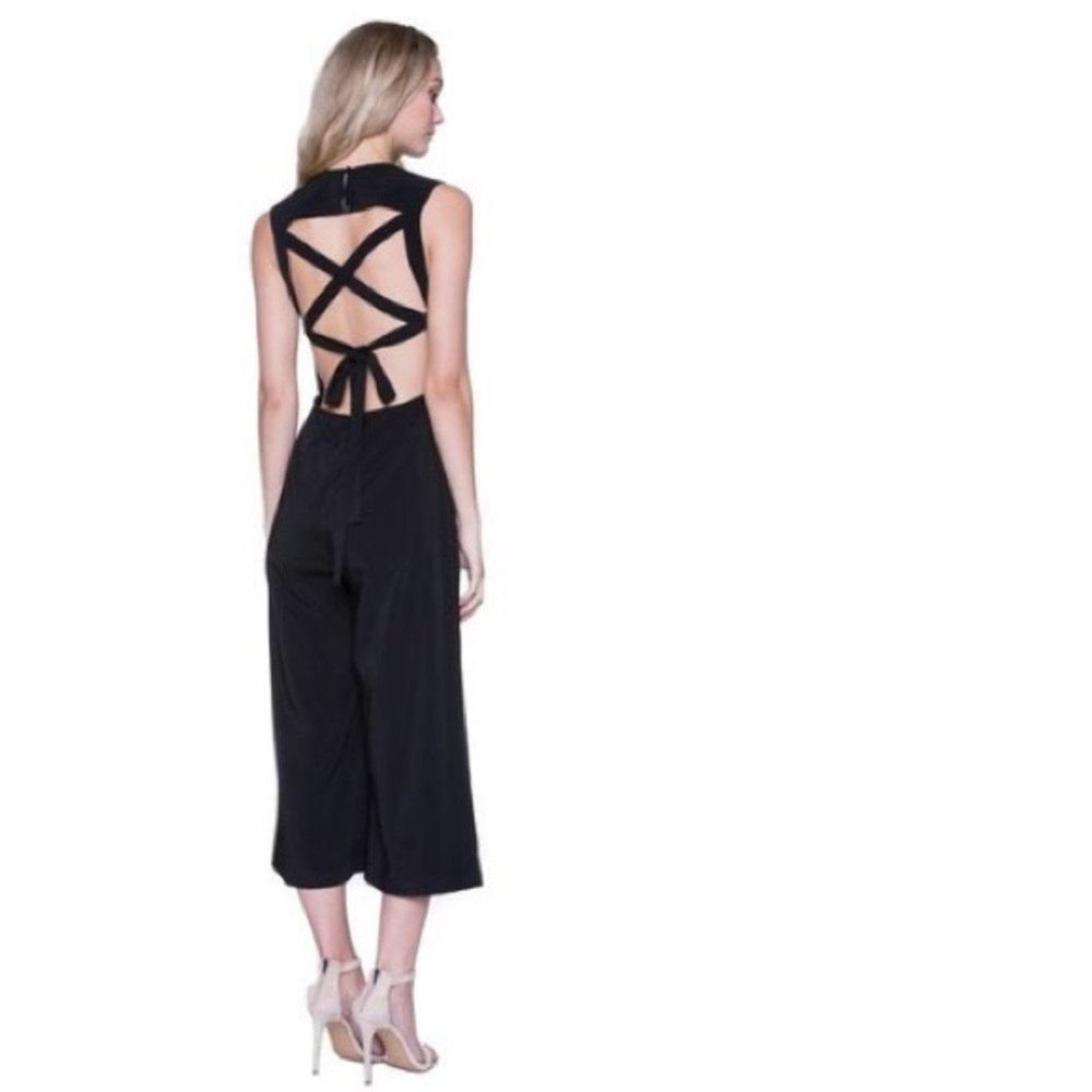 Cute black jumpsuit with strappy back detail.