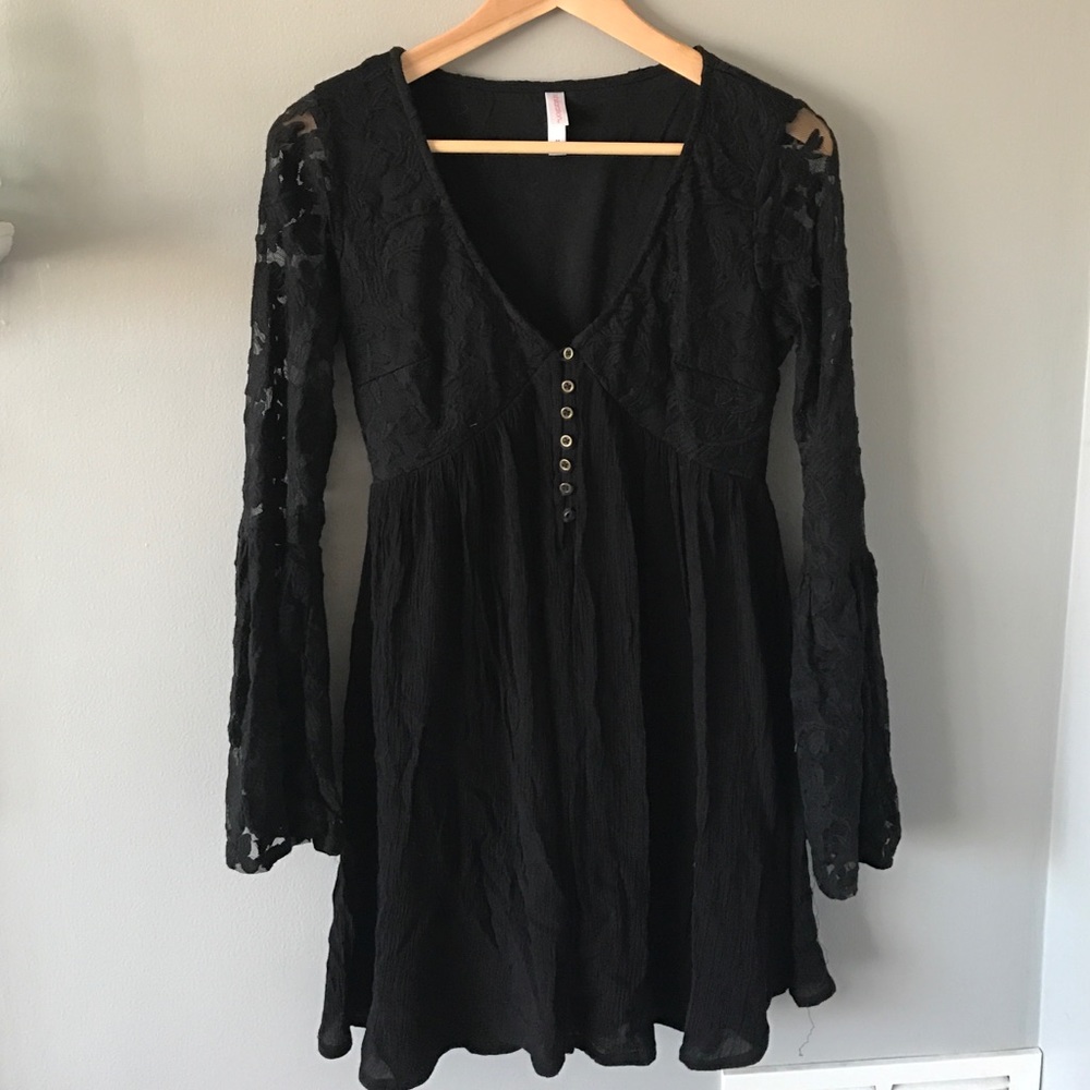 Bell sleeved black dress