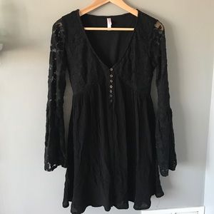 Bell sleeved black dress