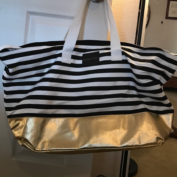 Victoria secret maybe in gold striped beach tote