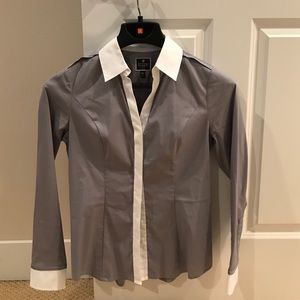 Gray  and white woman's dress shirt.