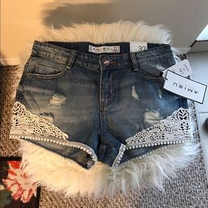 Laced denim shorts.