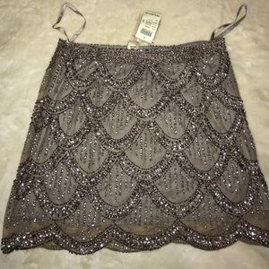 Scallop hem beade skirt.