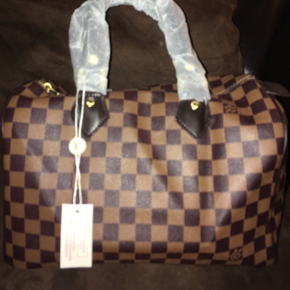 Oval shaped brown LV bag