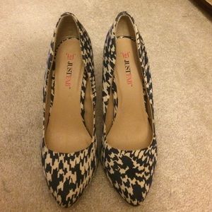 Navy and tan colored patterned high heels.