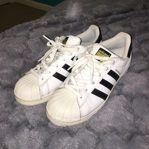 white and black adidas superstars