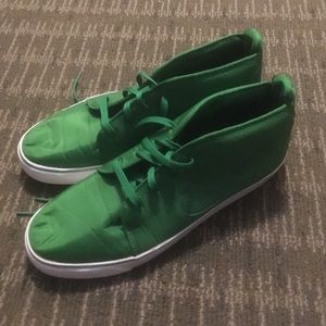 Size 14 Green Nike high top sneakers.