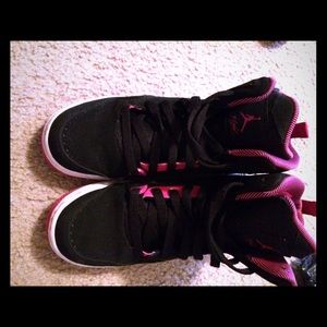 Black and pink Jordan's