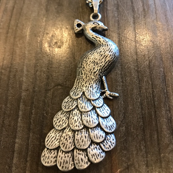 Long silver peacock pendant necklace