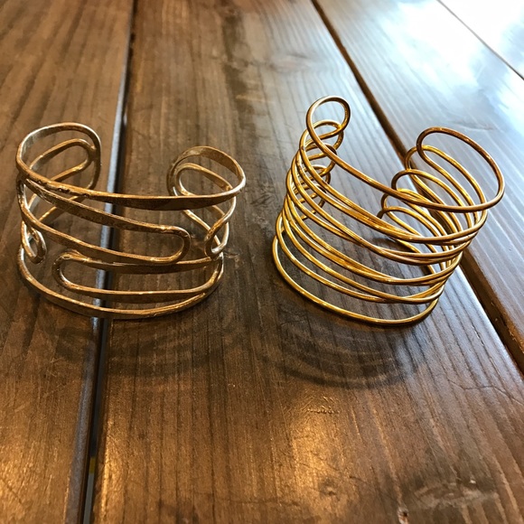 Two faux gold and faux silver cuff bracelets