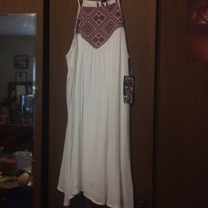 White dress red tribal stitching at top