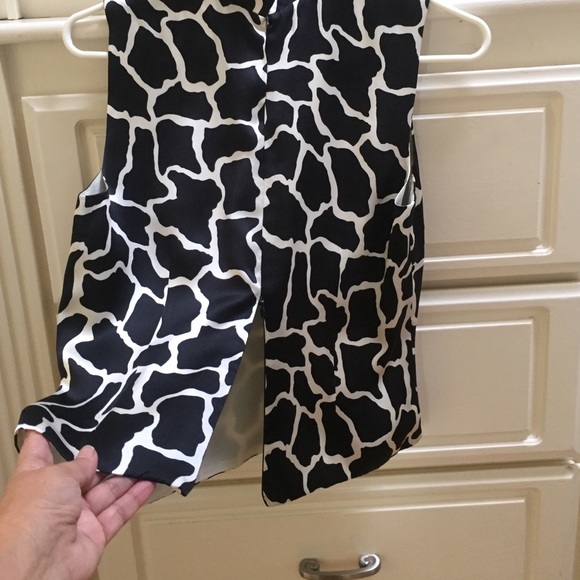 Black and with slick top with zippers on the back - Picture 2 of 3