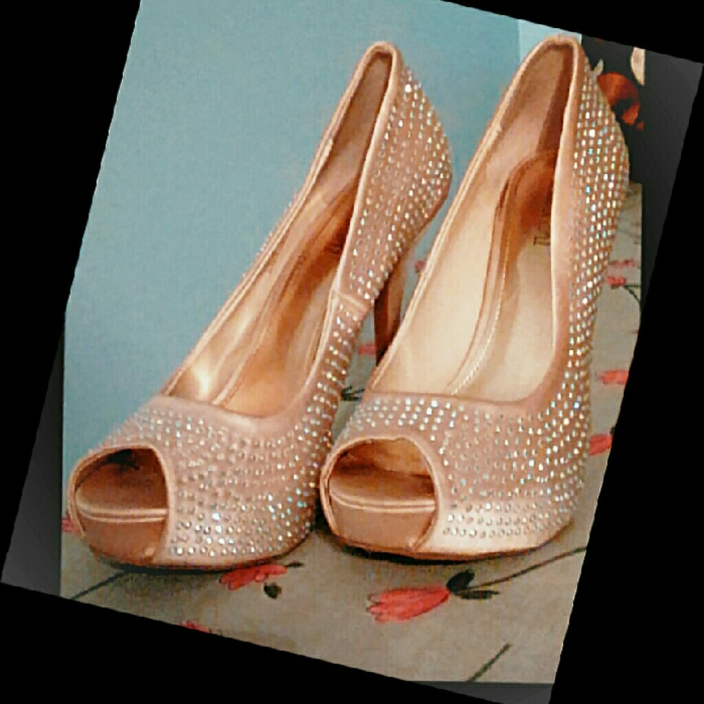 Jennifer Lopez pink peep toe platform heels