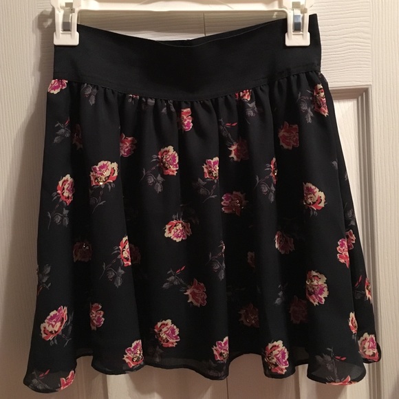 Navy blue mini skirt with flowers, gently worn