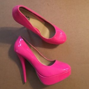 Hot pink platform pumps