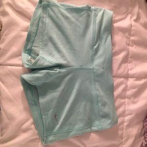Mint green Nike running shorts