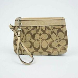 Coach wristlet/clutch. Brown/Tan. Good condition!