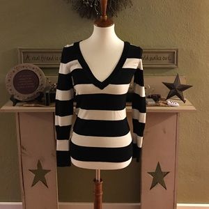 Navy blue and white striped sweater.