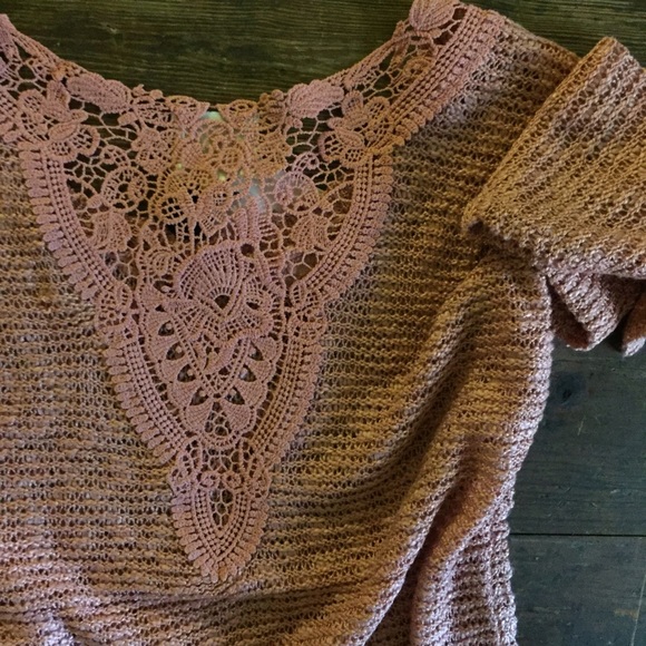 Rose-colored pullover sweater with crocheted back