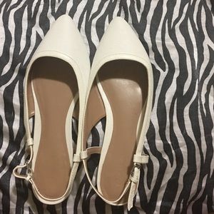 White flats with straps on the back