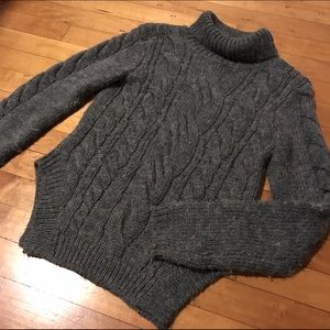 Gray cable knit turtleneck sweater