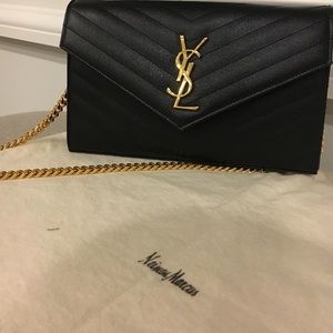 Saint Laurent Monogram leather chain wallet.