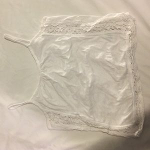 White tank top with lace on sides and bottom