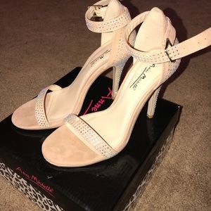 Nude heels with iridescent rhinestones.