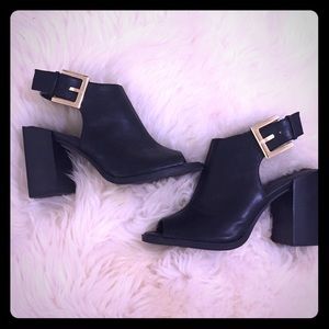 Black heels with gold lock