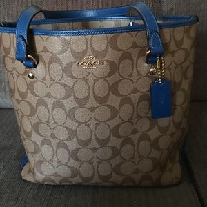 Coach purse with blue trim