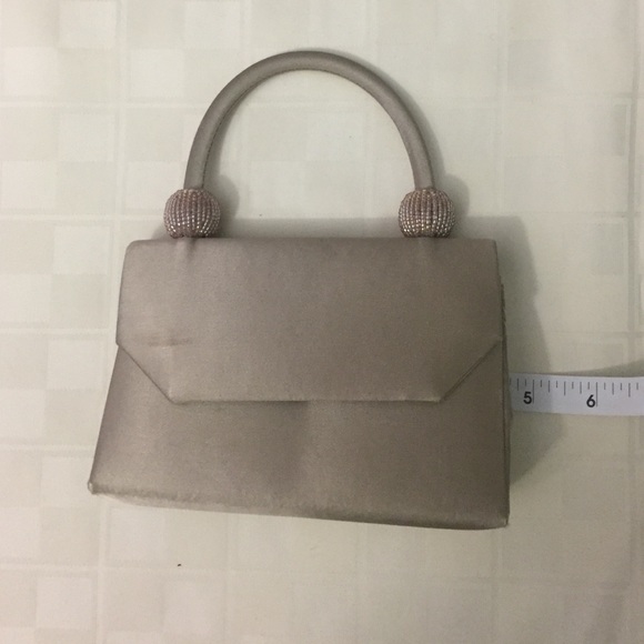 Champagne colored evening bag. With optional strap