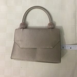 Champagne colored evening bag. With optional strap