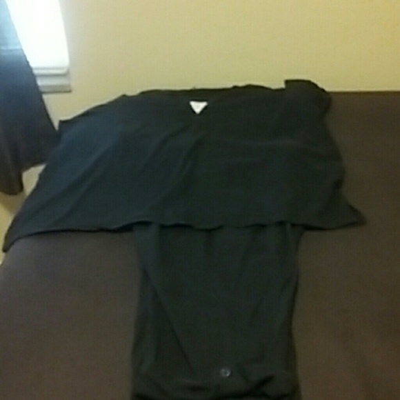 Black capries,  and black shirt with a white v