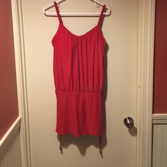 Red colored one piece tummy tuck VS bathing suit.