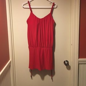 Red colored one piece tummy tuck VS bathing suit.