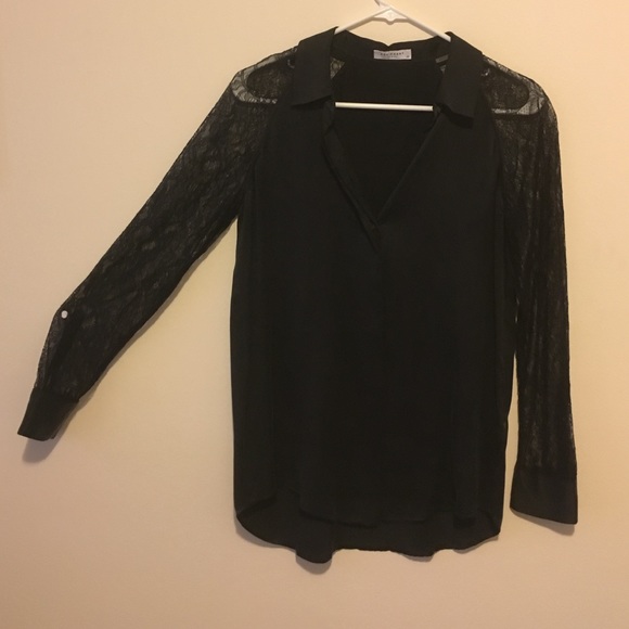 Equipment shirt with lace arms.