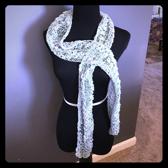 Gorgeous loose weave icy blue scarf.