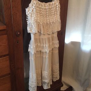 Cream lace, tasseled and flowy dress.