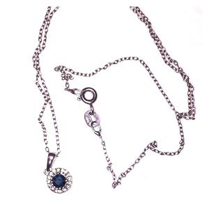 1/2 carat Blue Diamond necklace with diamond halo