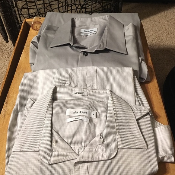 2 men's Calvin Klein dress shirts