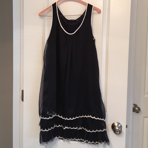 Sheer layered navy dress with white details.