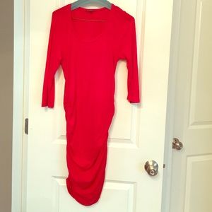 Cinched sides, fitted red cocktail dress