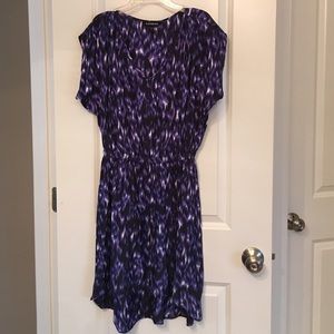 Asymmetrical, cinched waist, satin dress.