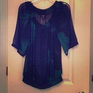Sheer tunic style. Cinched waist.