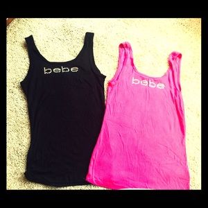 2 black and pink tank tops by Bebe