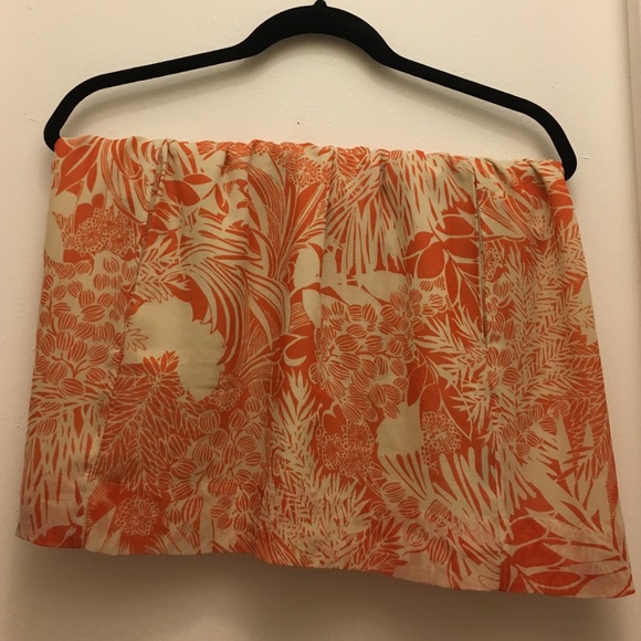 A orange and cream skirt.