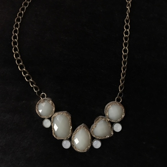 White and gold stone necklace.