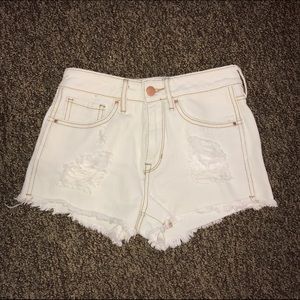 SIZE 23 HIGH-RISE DISTRESSED CUTOFF SHORTS
