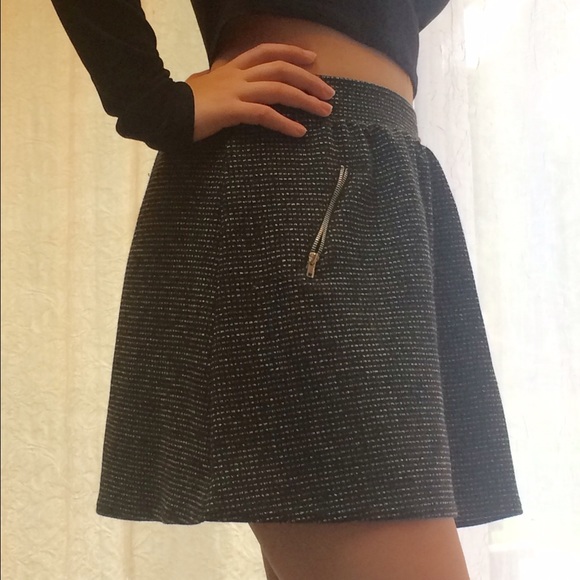 Black and white skirt with zippers.