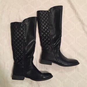 Tall black riding boots